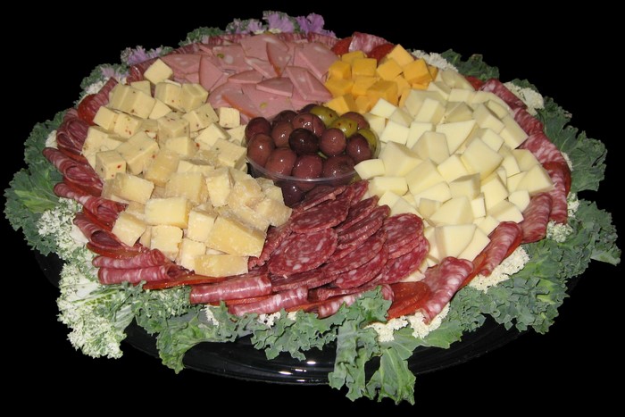 Charcuterie board with cheese, salami, and olives