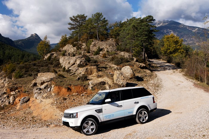White 2011 Range Rover Sport on a dirt road
