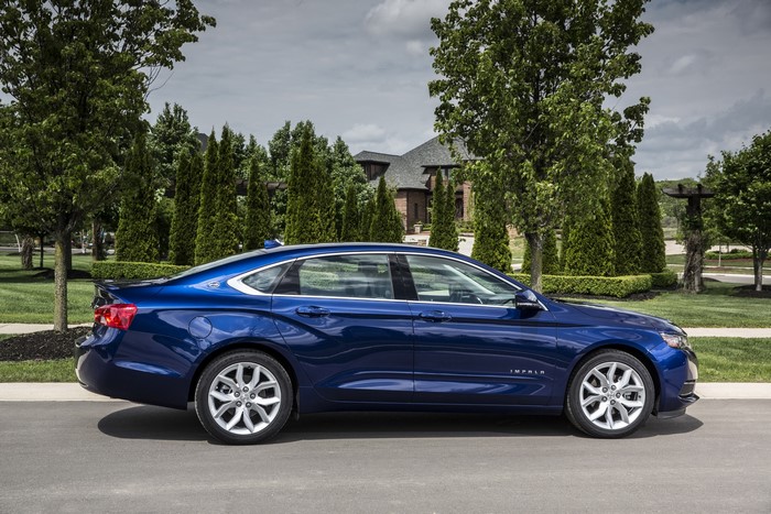 Blue Chevrolet Impala parked on a street
