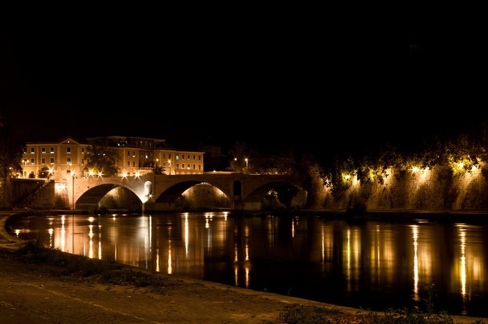 Ponte Sant'Angelo bridge at night in Rome, Italy