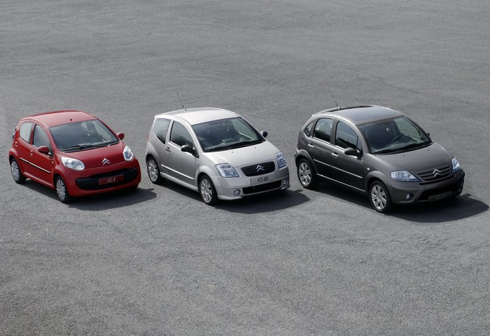 Three Citroen cars parked on asphalt