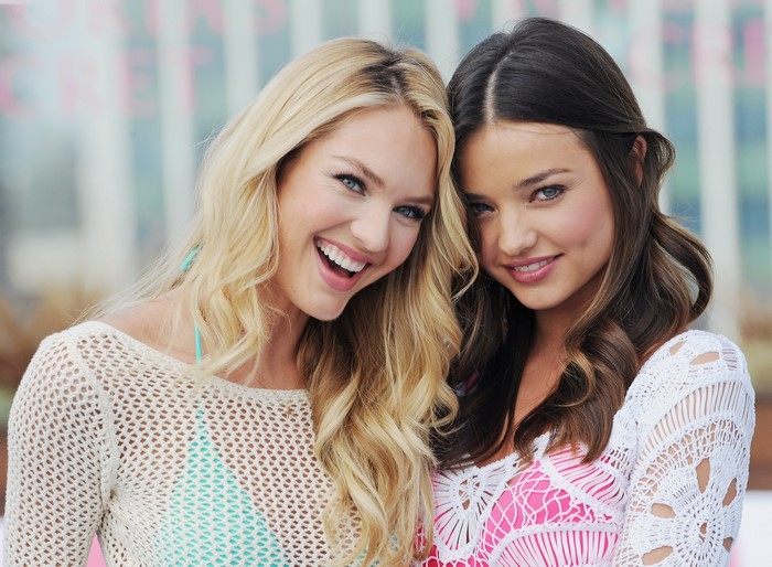 Candice Swanepoel and Miranda Kerr smiling
