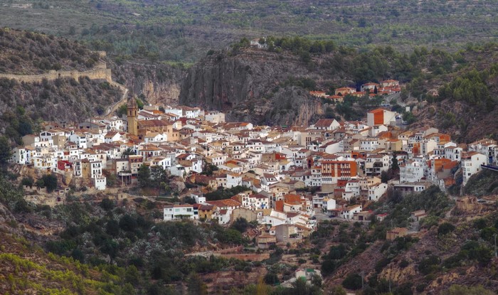 Village of houses nestled in a valley in Spain