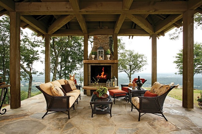 Outdoor living room with fireplace and mountain view