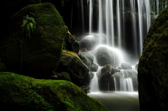 4K Waterfall Over Mossy Rocks