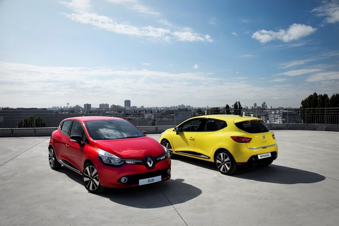 Red and yellow Renault Clio cars on rooftop