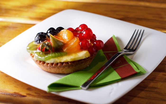 Fruit Tart with Fork on White Plate