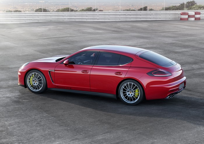 Red 2013 Porsche Panamera GTS on asphalt