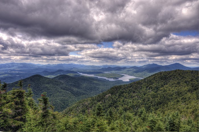 Mountainous landscape with a lake and cloudy sky