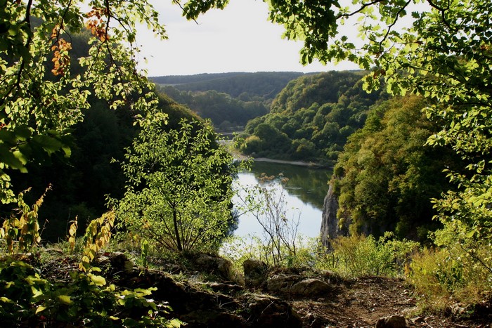 River valley with forested hills in Bavaria, Germany