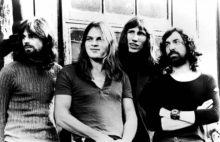 Pink Floyd band members posing outdoors