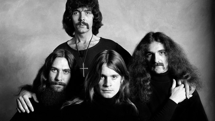 Black Sabbath band members posing for a portrait