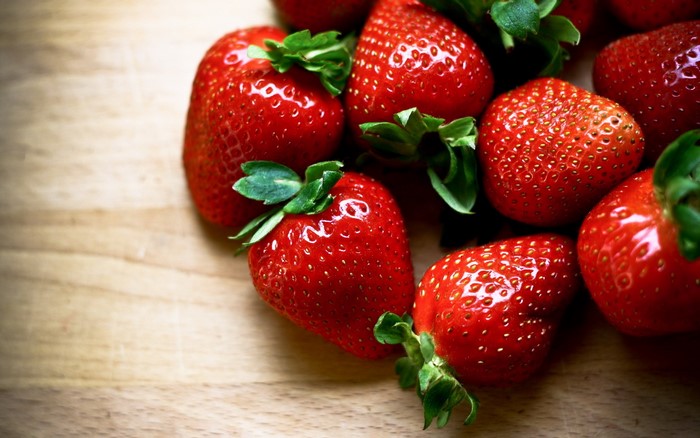 Fresh Strawberries on a Wooden Surface