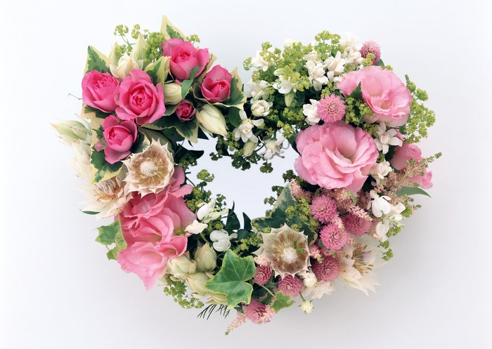 Heart-shaped floral arrangement with pink roses