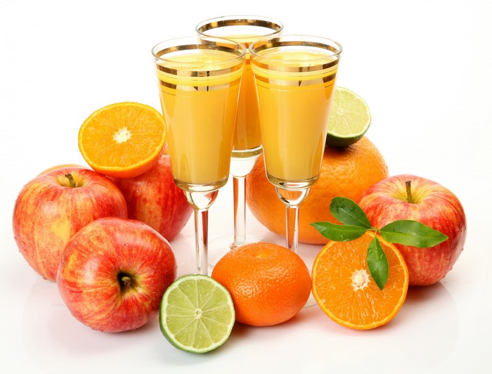 Juice in Stemware with Apples and Citrus Fruits