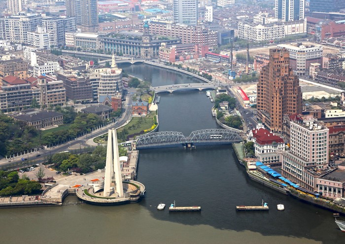 Shanghai cityscape with bridges and river from above