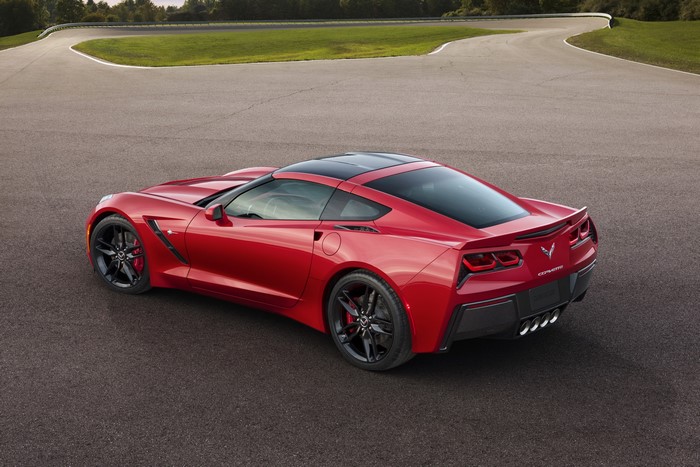 Red 2014 Chevrolet Corvette C7 Stingray on a Racetrack