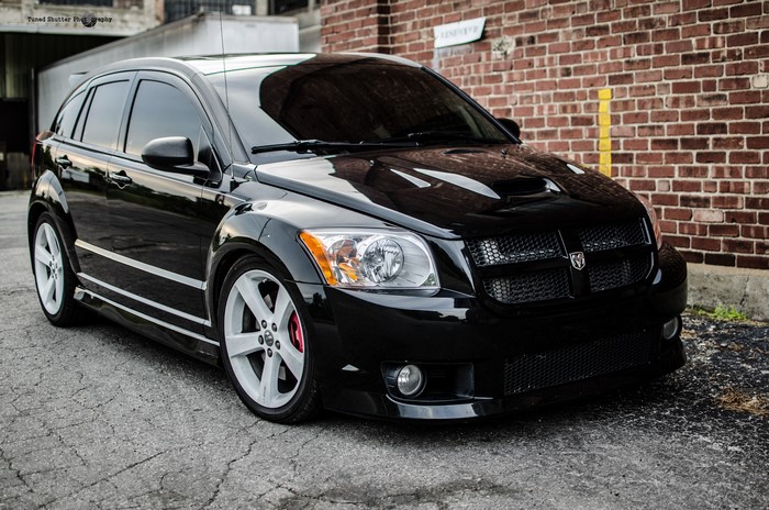 Black Dodge Caliber SRT-4 with white rims