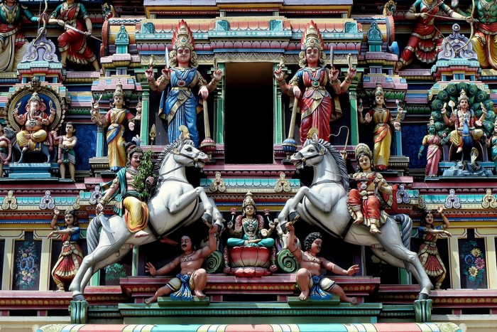 Colorful Hindu temple sculptures of deities and horses