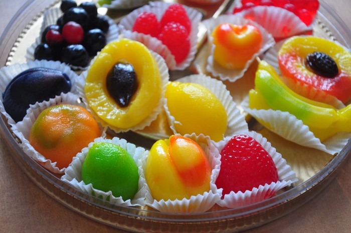Assortment of colorful fruit-shaped marzipan candies