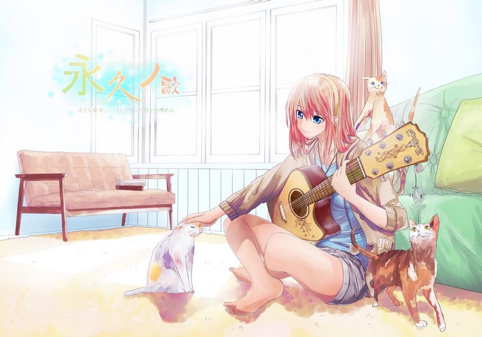 Girl playing guitar with cats