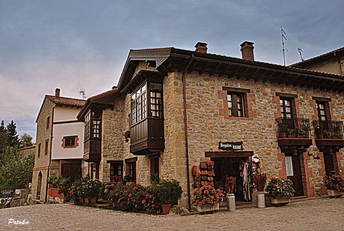 Stone houses with balconies and shops in Santillana del Mar, Spain
