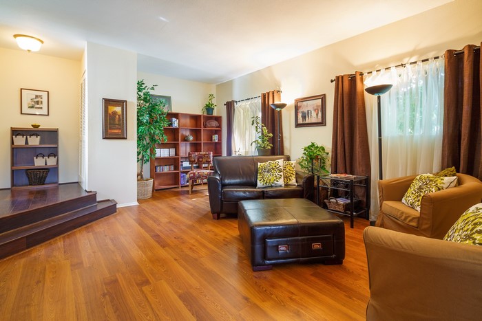 Living room with leather sofa and armchairs