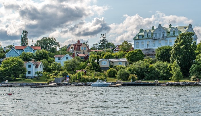 Houses on a hill overlooking a river in Sweden