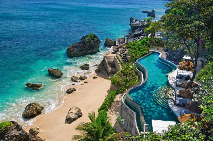 Infinity Pool Overlooking a Tropical Beach in Bali, Indonesia