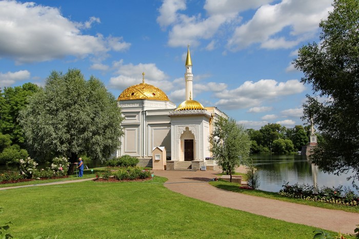 Mosque with golden domes in a park near a lake in Russia