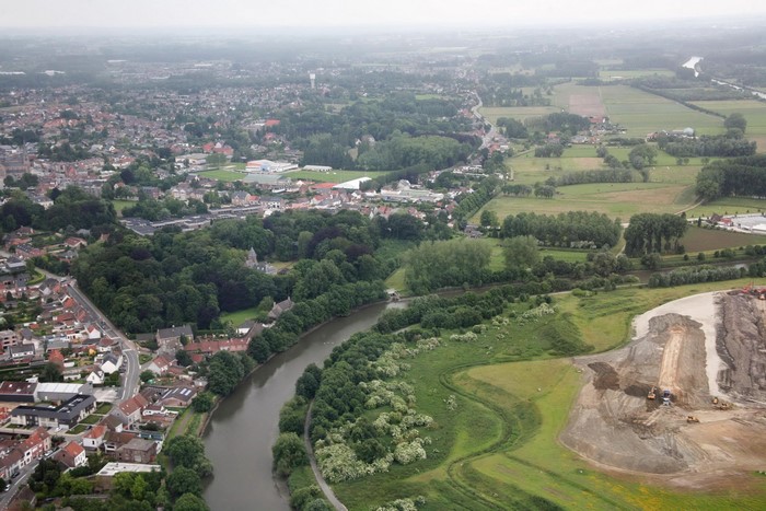 Aerial view of Merelbeke, Belgium with a river and construction site