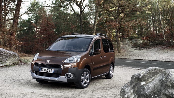Brown Peugeot Partner Tepee parked on gravel road
