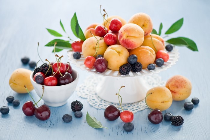 Fresh fruit assortment on a blue wooden table