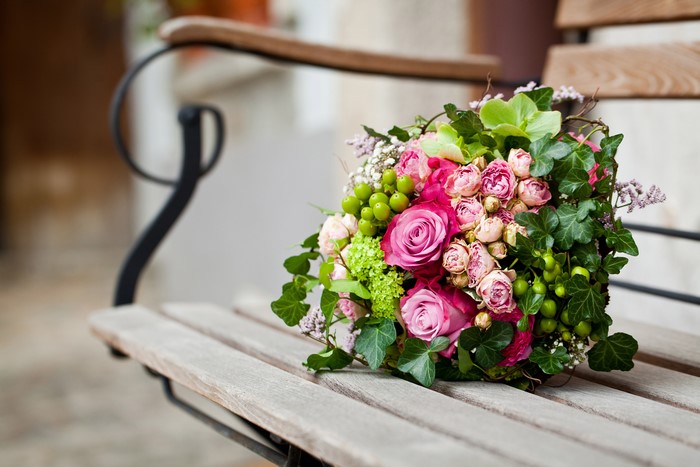 Bouquet of Roses on a Wooden Bench