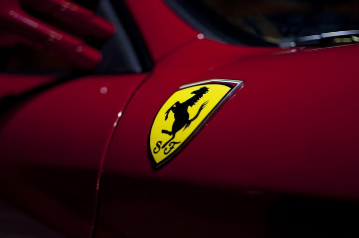 Ferrari logo emblem on red car