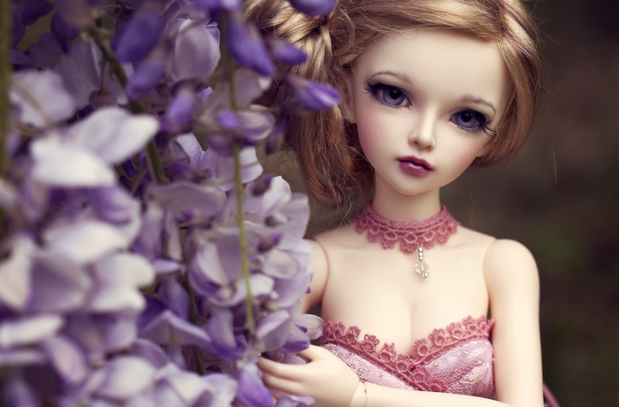 Doll with purple flowers