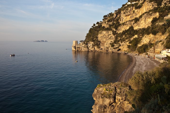 Coastline with cliffs and buildings in Positano, Italy