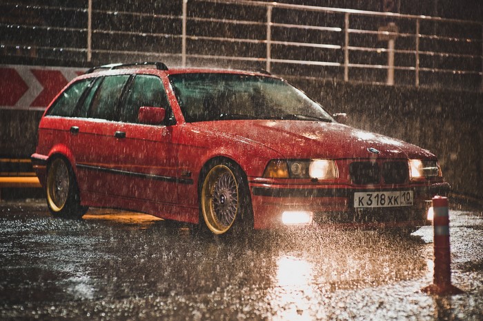 Red BMW E36 Wagon in Rain