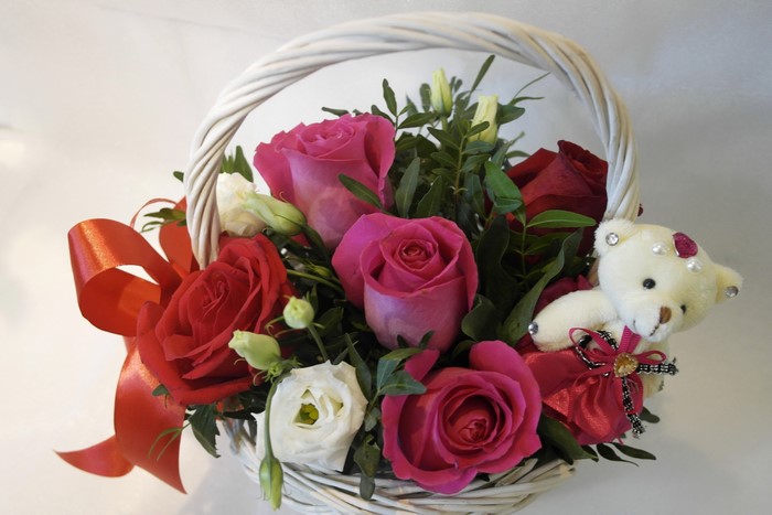 Flower basket with roses and teddy bear