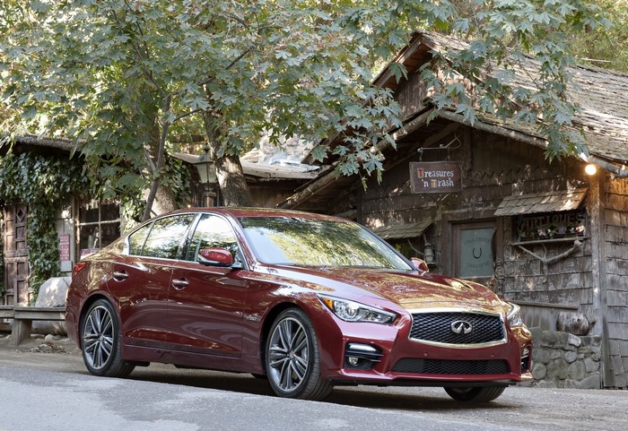 2013 Infiniti Q50S parked near a rustic building