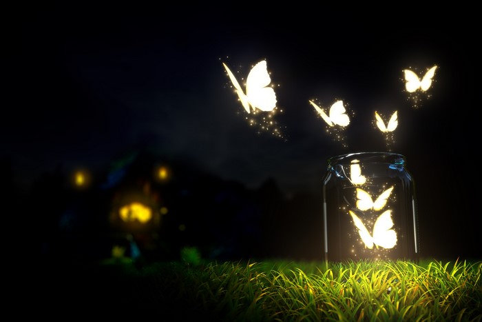 Glowing butterflies flying out of a jar at night