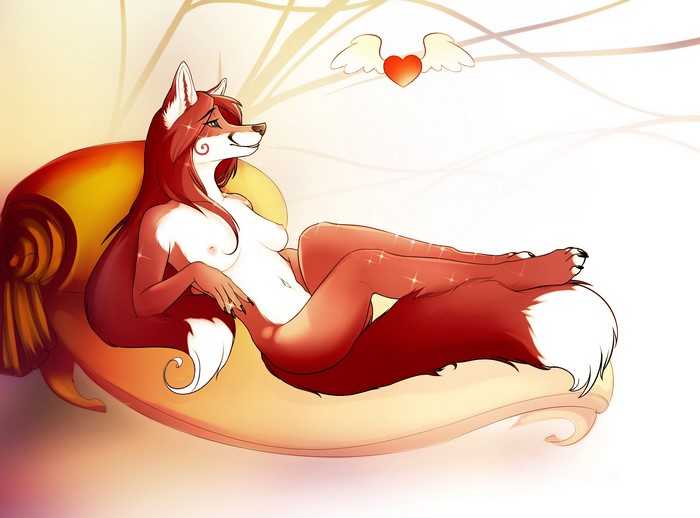 Naked fox woman lounging on a chaise lounge