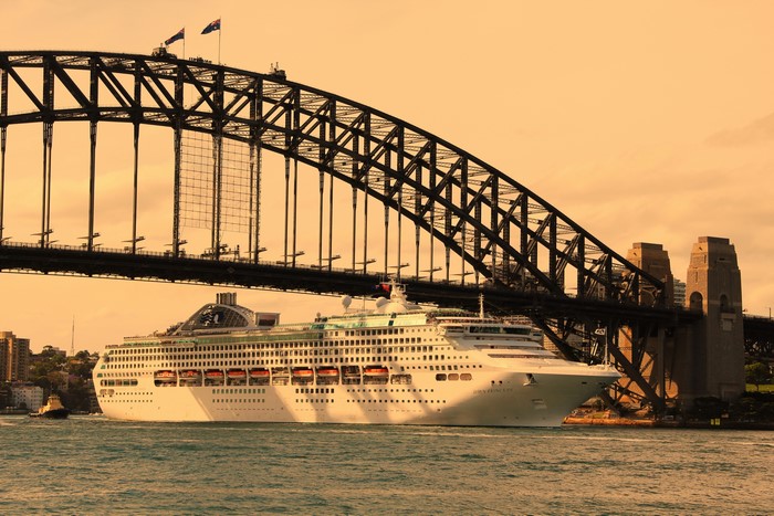 Cruise liner passing under Sydney Harbour Bridge