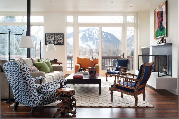 Living room with fireplace and mountain view