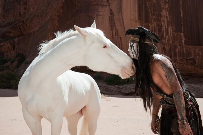 The Lone Ranger from The Lone Ranger (2013 film) with a white horse