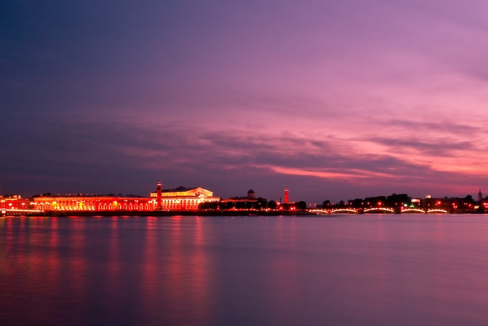 St. Petersburg skyline at dusk with illuminated buildings and river