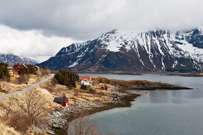 Coastal village with snow-capped mountains in Lofoten, Norway