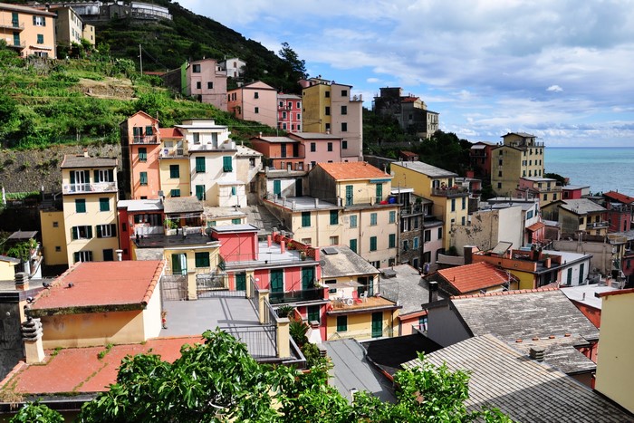 Colorful houses on a hillside in Riomaggiore, Italy
