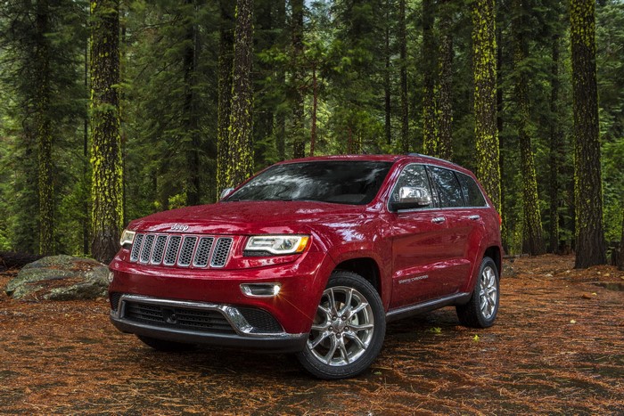 Red Jeep Grand Cherokee Summit in Forest