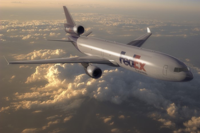 FedEx Express Cargo Plane Flying Above Clouds